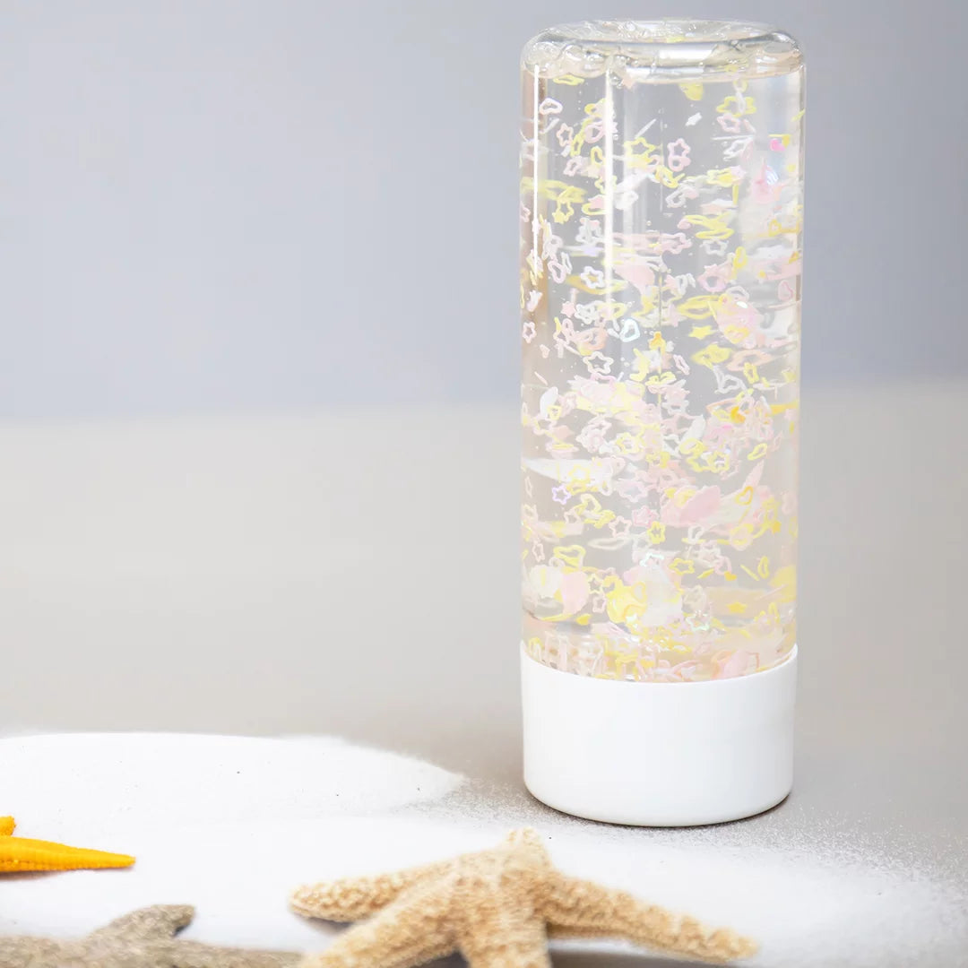 bouteille sensorielle coquillages jaunes et roses